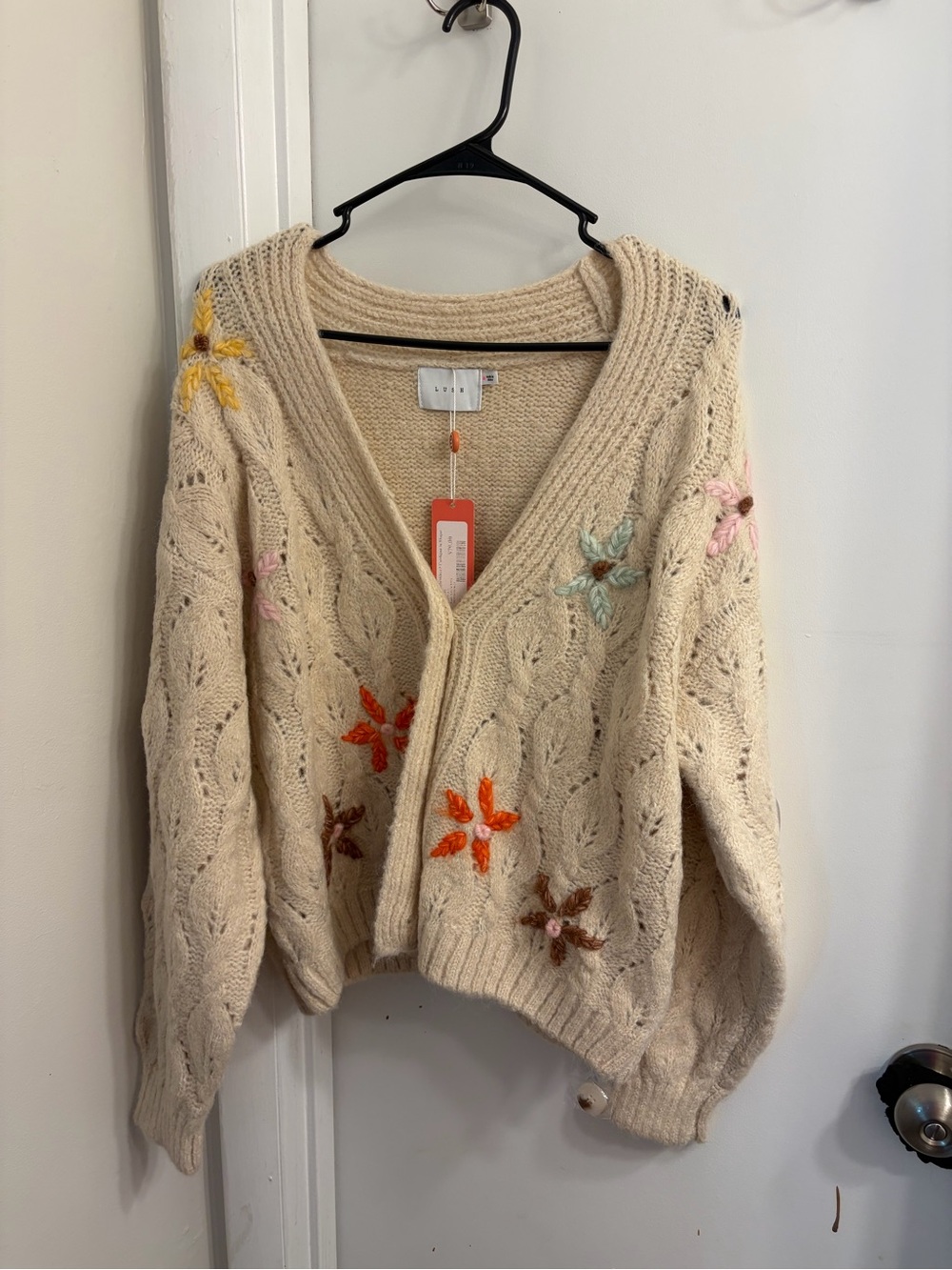 Lush Cream Cable-Knit Cardigan with Colorful Floral Embroidery